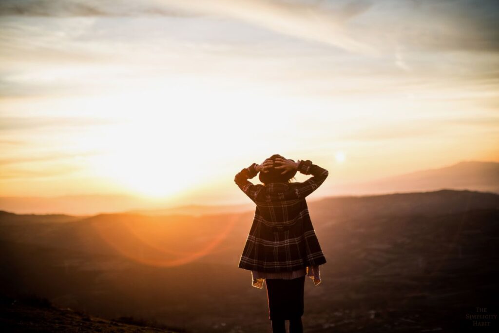 woman looking at the sunset